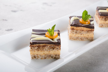 Three pieces of chocolate cakes decorated with mint
