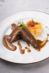 Steamed beef meat served with baked potato