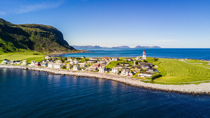 Countryside road to the sea in summer in Alnes, godoy island, Norway. Aerial shot from drone of norway landscape