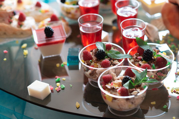 Luxurious desserts and drinks at the buffet table. Shallow depth of field.