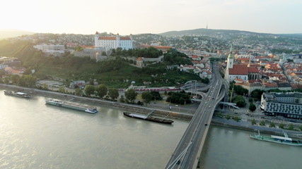 Fototapeta na wymiar Bratislava Aerial Cityline (Slovakia): European Capital with Old Town, Castle, Church and Most SNP (Ufo Car Road Bridge) across Danube River at Sunset