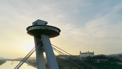 Amazing Aerial View of Bratislava (Slovakia): European Old Town, Castle and Most SNP (Ufo Car Road Bridge) across Danube River at Summer Sunset © OPEN FILMS