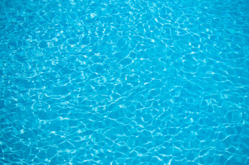 little waves in a pool blue with reflections