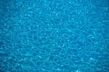 little waves in a pool blue with reflections