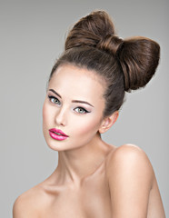 Beautiful woman with stylish bow hairstyle.