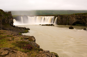 Long exposure photo of waterfall, view of the Godafoss waterfall in northern Iceland, Europe.