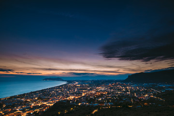 Terracina, Italy. Top View Skyline Cityscape City In Evening Night Illuminations