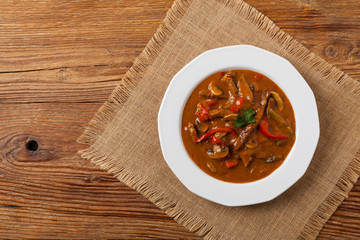 Boeuf, Stroganow, Strogonow. Classic, Russian beef stew. Served on a white plate. Top view. Natural background.