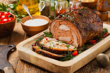 Roasted whole, stuffed with minced pork neck.