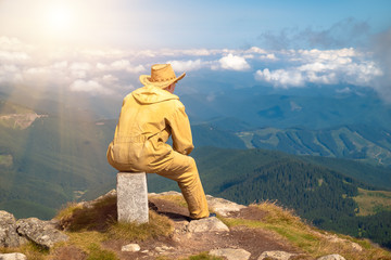 Man on top mountain looking into the distance
