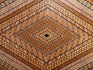 Abstract and geometric mosaic marquetry wooden surface. Diamond shape pattern.