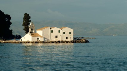 Orthodox Church on an island in the Mediterranean sea. Greece. 4K