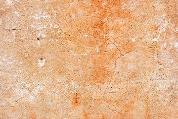 Texture of a concrete wall with cracks and scratches which can be used as a background