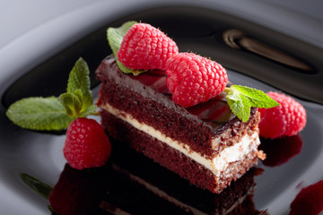 Chocolate cake with raspberry .