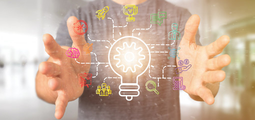 Businessman holding a Bulb lamp idea concept with start up icon connected 3d rendering