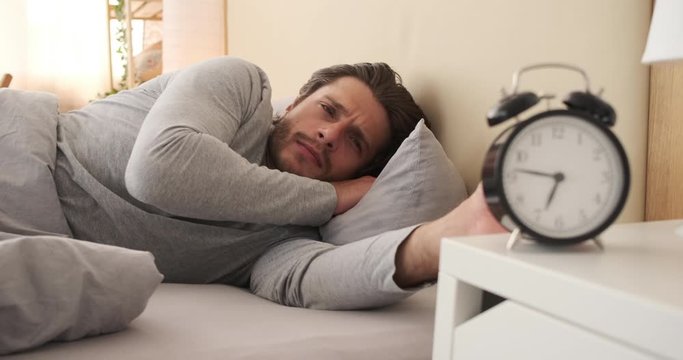 Man shocked on waking up and checking alarm realizing his late for work