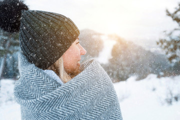 Portrait Happy woman traveler on the snowy of mountain look on t