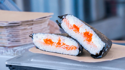 Japanese sushi rolls at russian street food market festival. Outdoor cooking, gastronomy, asian food and service concept