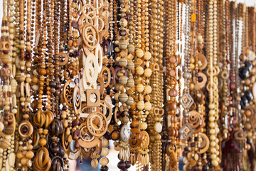 Close up view of wooden beads at souvenir market