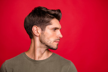 Fototapeta premium Photo of macho guy turn head side showing new hairstyle wear grey t-shirt isolated on red background