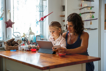 Mother paying with credit card from home