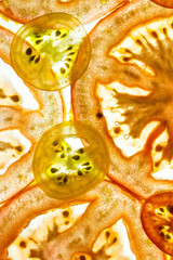 Tomato slice backlit. Abstract food background.