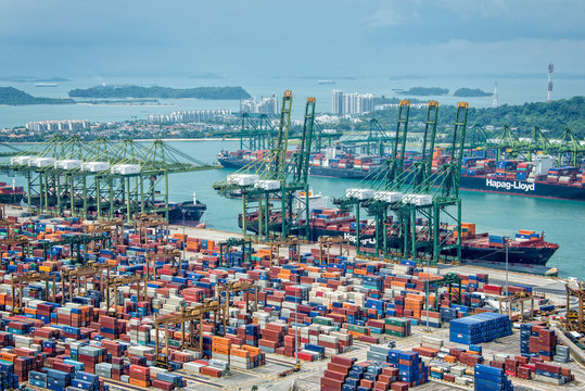 Aerial view of the port of Singapore, the busiest asian commercial port with cargo ships and containers