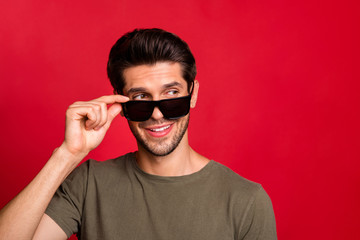 Cool guy looking pretty girl flirty mood wear grey t-shirt isolated on red background