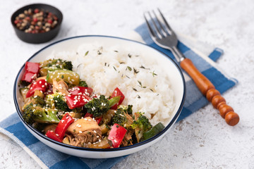 rice with vegetable stir fried on blue plate