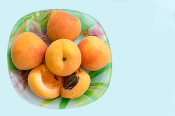 Ripe large peaches plate. Healthy food organic. Green background.  Healthy breakfast. Natural food. Fresh fruit.