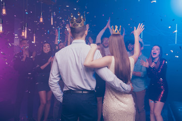 Back side view portrait of lovers have become king queen celebrating scream buddies enjoy dance floor