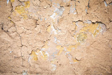 Cracked wall with old layers of paint. Free space for text, copy space