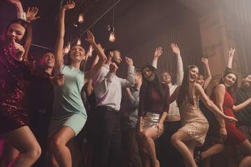 Low angle view photo of charming funny funky people youth having fun motion raise hands close eyes laugh laughter dress suit stylish trendy beautiful handsome sepia photo