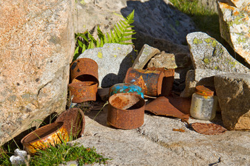 Envrionmental pollution: rusty tin cans left behind in a mountain camp