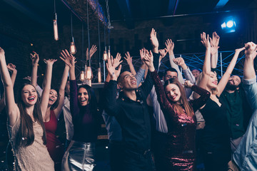 Portrait of excited good-looking magnificent fellows people millennial raise hands scream laughter rejoice content indoors disco suit dress formalwear formal wear