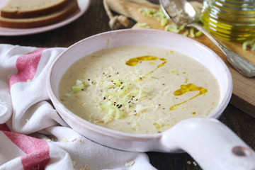 Oat soup with grated cheese and leek