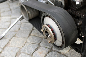 Motorcycle open primary belt drive. Close up image with copy space.