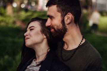 Fototapeta premium Head shot of young affectionate romantic couple in love. Close up portrait of attractive brunette girl and guy with eyes closed, close to each other. Concept of first kiss, tenderness and amorousness