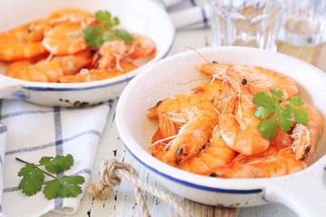 Two portions of fried shrimp