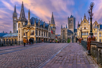 Fototapeta na wymiar Medieval city of Gent (Ghent) in Flanders with Saint Nicholas Church and Gent Town Hall, Belgium. Sunset cityscape of Gent.