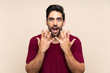 Obraz premium Handsome young man over isolated background with surprise facial expression