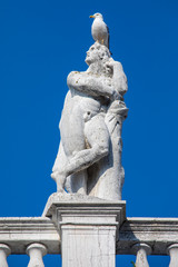 Fototapeta na wymiar Sculpture on the Biblioteca in Piazzetta di San Marco in Venice