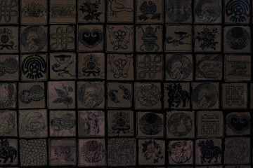 Ratchaburi/Thailand-May 19,2019: Chinese patterned tile wall. Construction material texture.