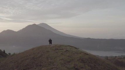 Couple standing on mountain top
