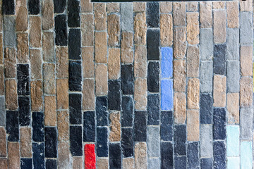 Black and brown tone brick wall. Construction material texture.
