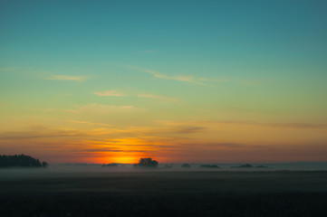 A summer sunrise with tender perl colors and mistic mist 