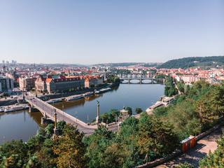 Fototapeta na wymiar Scenic summer sunrise aerial view of the Old Town pier architecture and Charles Bridge over Vltava river in Prague, Czech Republic, travel tour to Europe concept design.