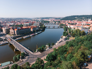 Obraz premium Scenic summer sunrise aerial view of the Old Town pier architecture and Charles Bridge over Vltava river in Prague, Czech Republic, travel tour to Europe concept design.