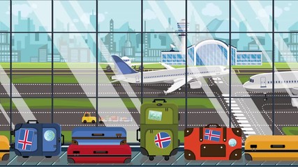 Suitcases with Iceland flag stickers on baggage carousel in airport. Icelandic tourism related loopable cartoon animation