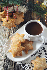 New Year composition: cup of coffee and Christmas cinnamon cookies